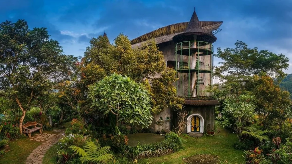 Museum Affandi's distinctive banana-leaf roof building surrounded by a garden