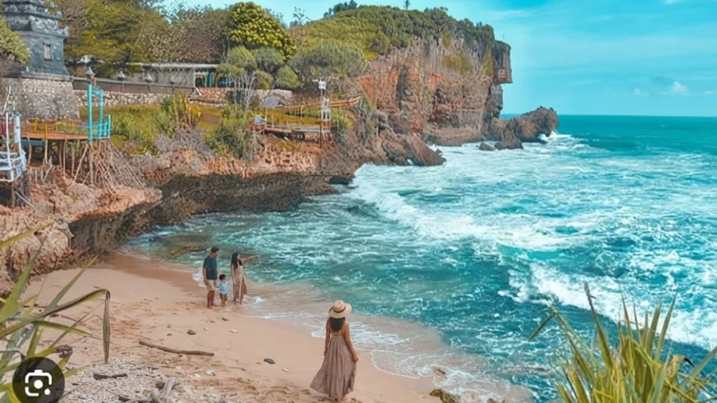 Hindu temple structure on the cliffside terrace at Pantai Ngobaran overlooking the ocean